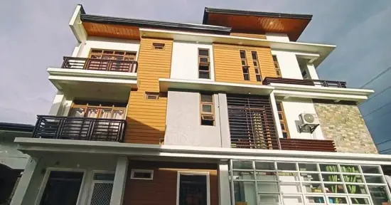 Light oak composite wall cladding installation