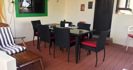 Mahogany finish composite decking covered patio installation